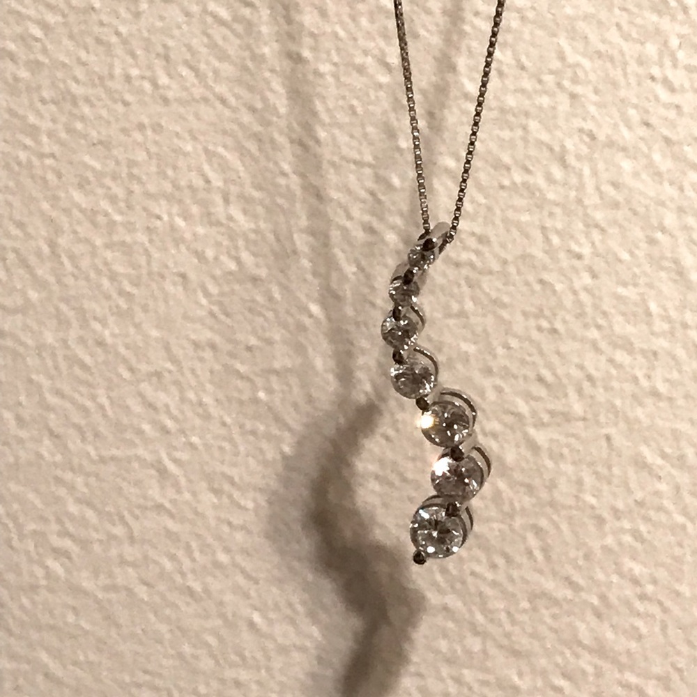 White gold 7 diamond necklace.